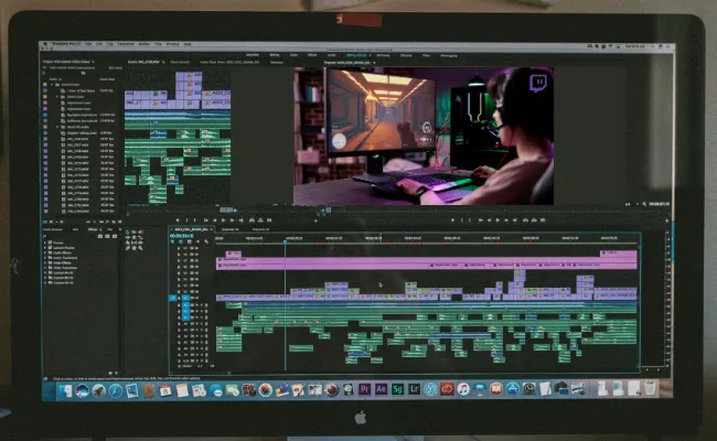 Editing interface on a desktop showing a gamer’s Twitch stream footage being compiled into a highlight reel with detailed timeline cuts, ideal for content creators repurposing live streams.