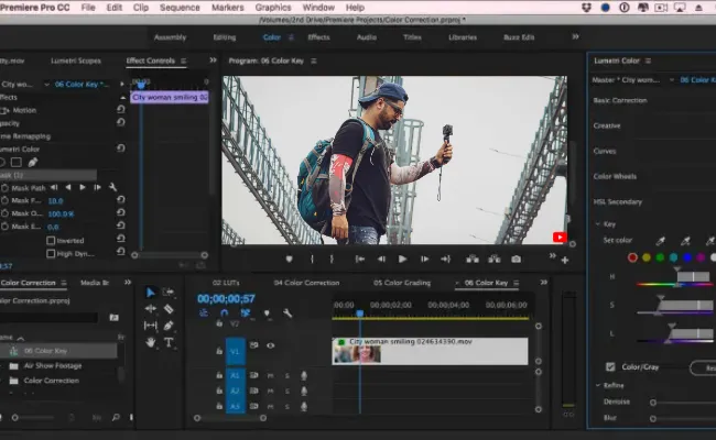 Video editing software interface showing a content creator holding a camera, used for editing platform-specific videos for YouTube Shorts and other content creator projects.