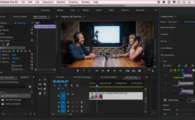 Editing timeline featuring a video podcast with two speakers in a studio, showcasing multi-camera cuts and color correction tools for professional content creator video editing.