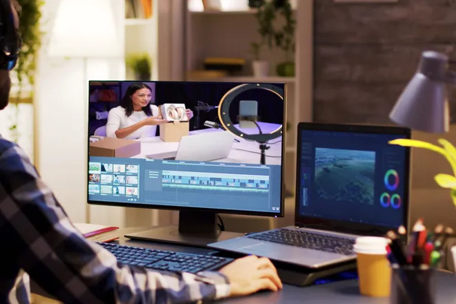 Video editor working on an unboxing video with a woman presenting a product on screen, highlighting Eterna Edits’ video editing services for business product demos and training content
